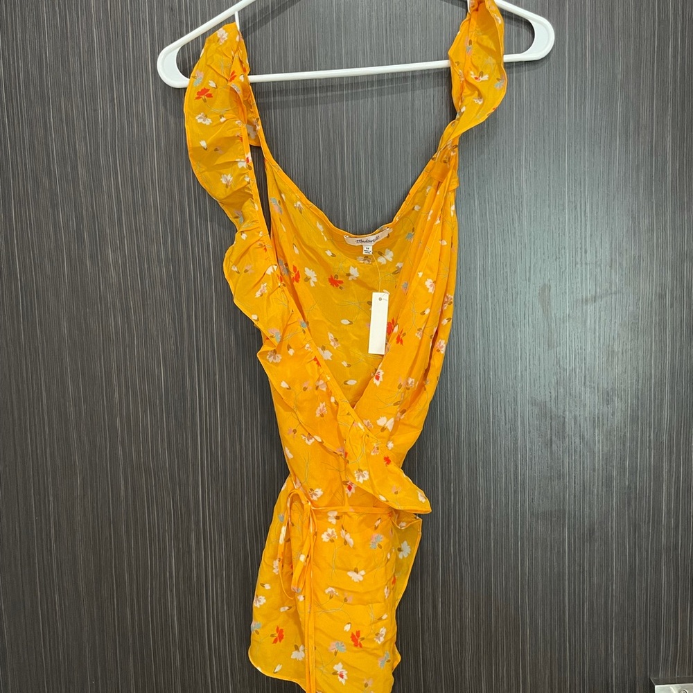 Lovely yellow wrap top with flowers. (NWT) never worn !